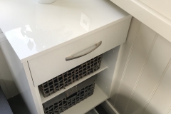 Side step storage with plinth drawer